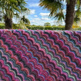 Rippling Meadow Blanket Knitted in Sirdar Jewelspun Aran